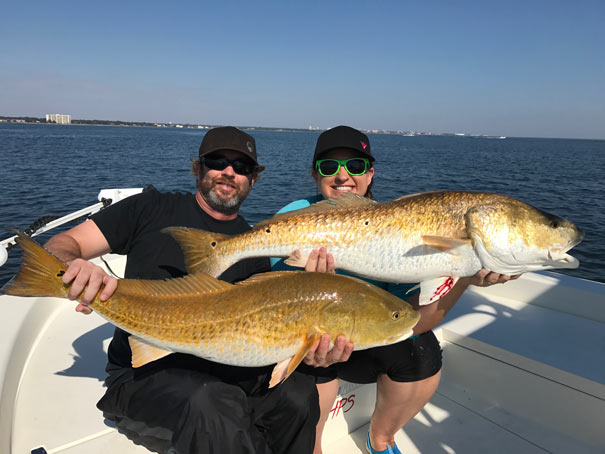 two redfish caught in Pensacola Bay on the Aqua Sol
